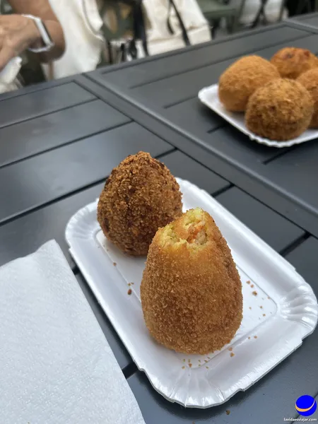 comer arancinos en Catania
